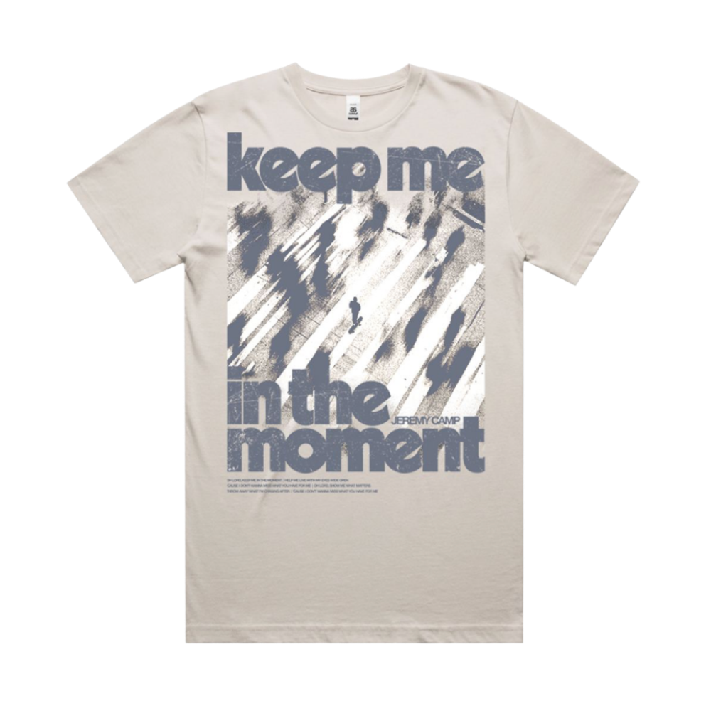"Keep Me In The Moment" T-Shirt features grey text and a subtle figure moving forward. This refers to Jeremy Camp's song, "Keep Me In The Moment"